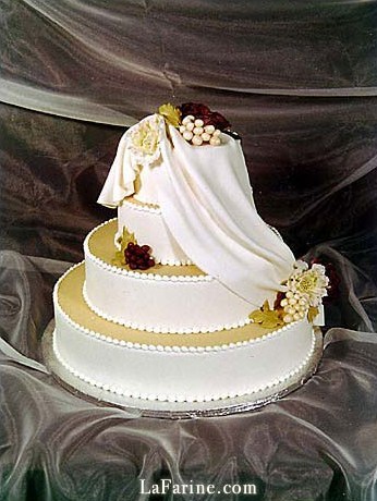 A wedding cake finished with a fondant drape
